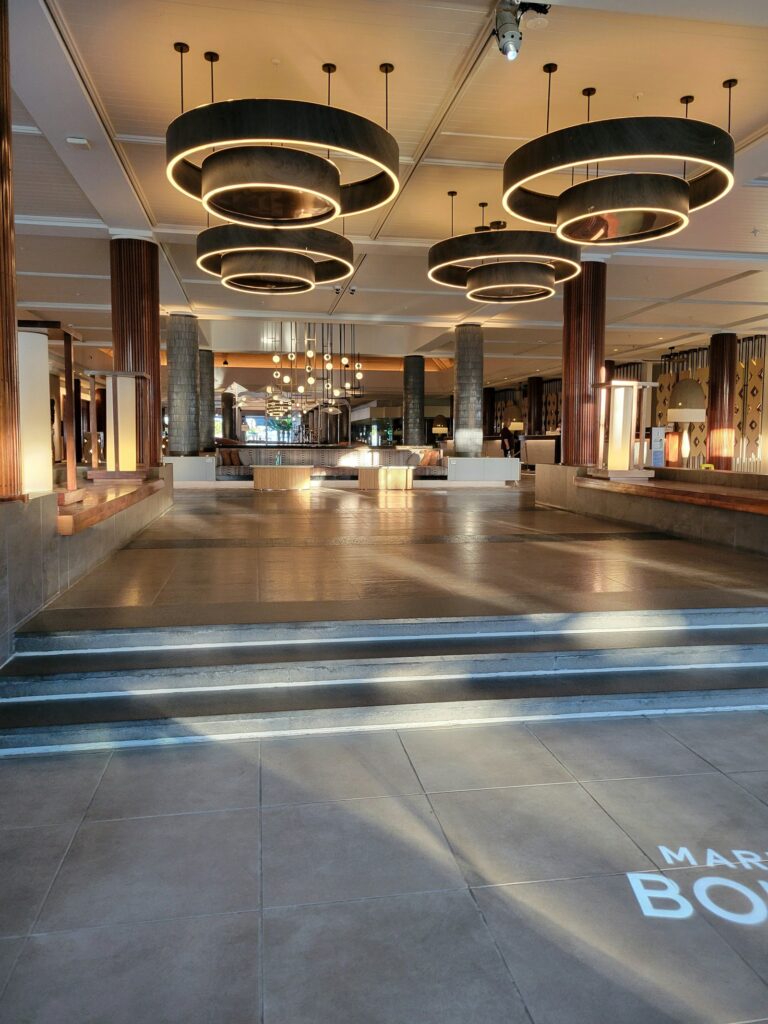 Luxury hotel lobby with an ascending staircase, hotel investment Malaysia