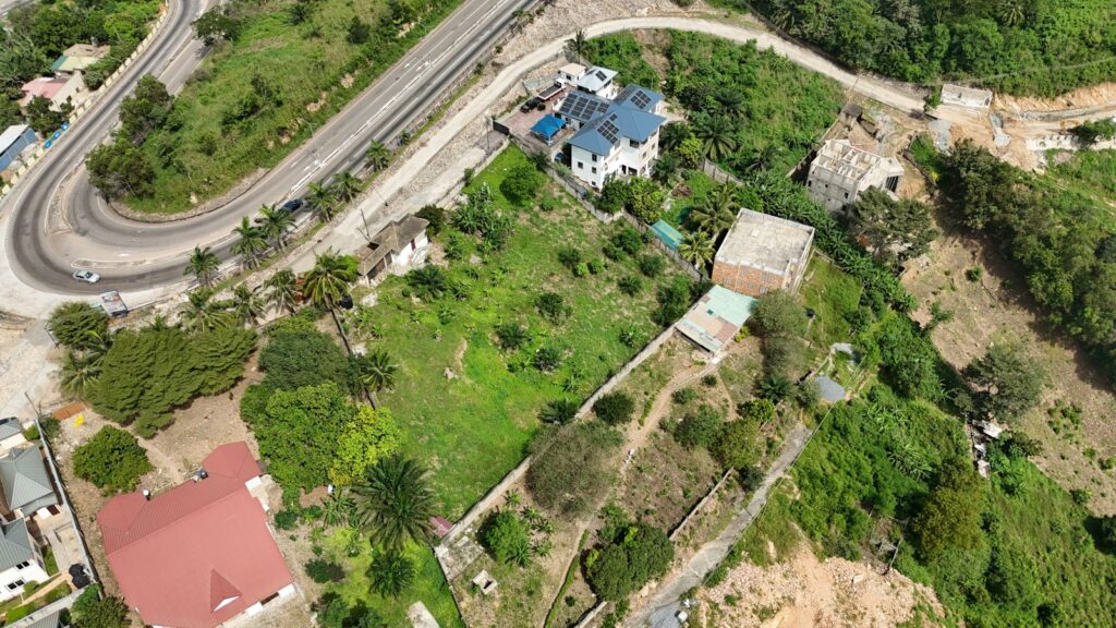 Aerial view of a hillside with road access