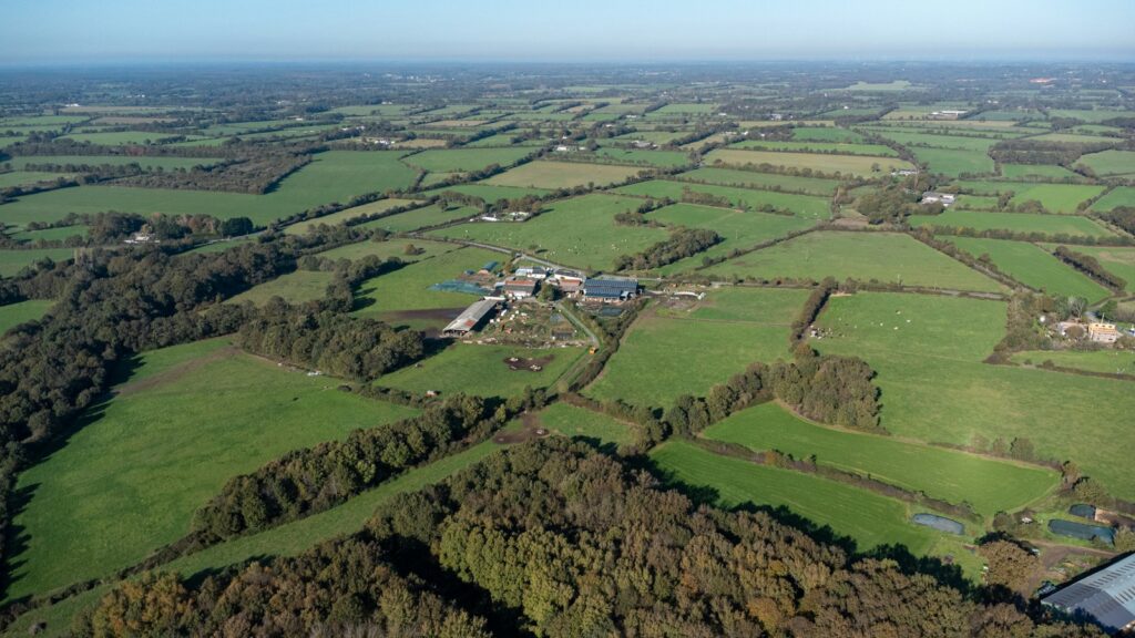 Wider landscape showing nearby settlement