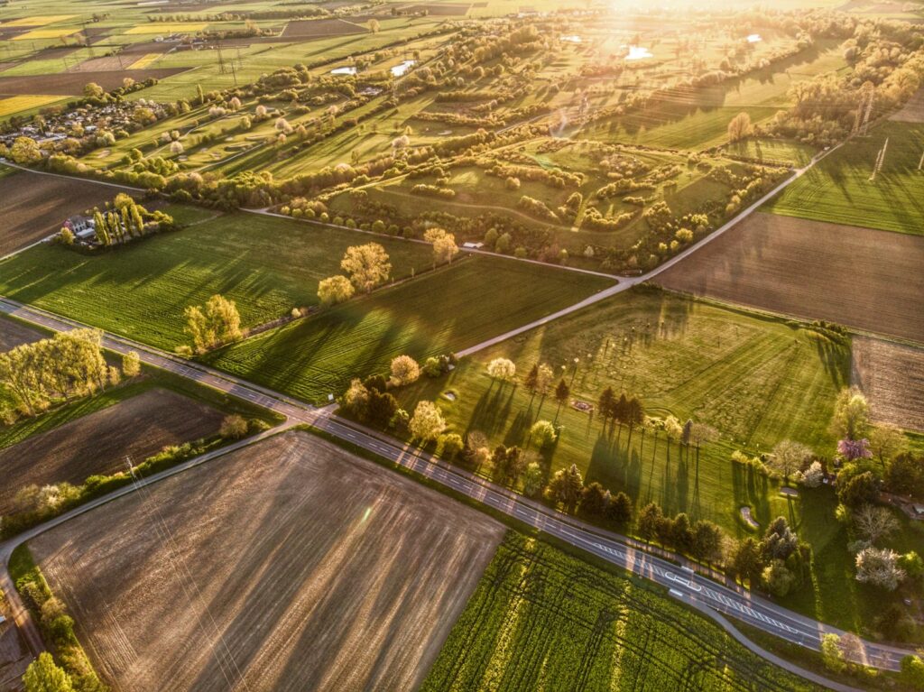 Aerial view of the rural surroundings and tree line