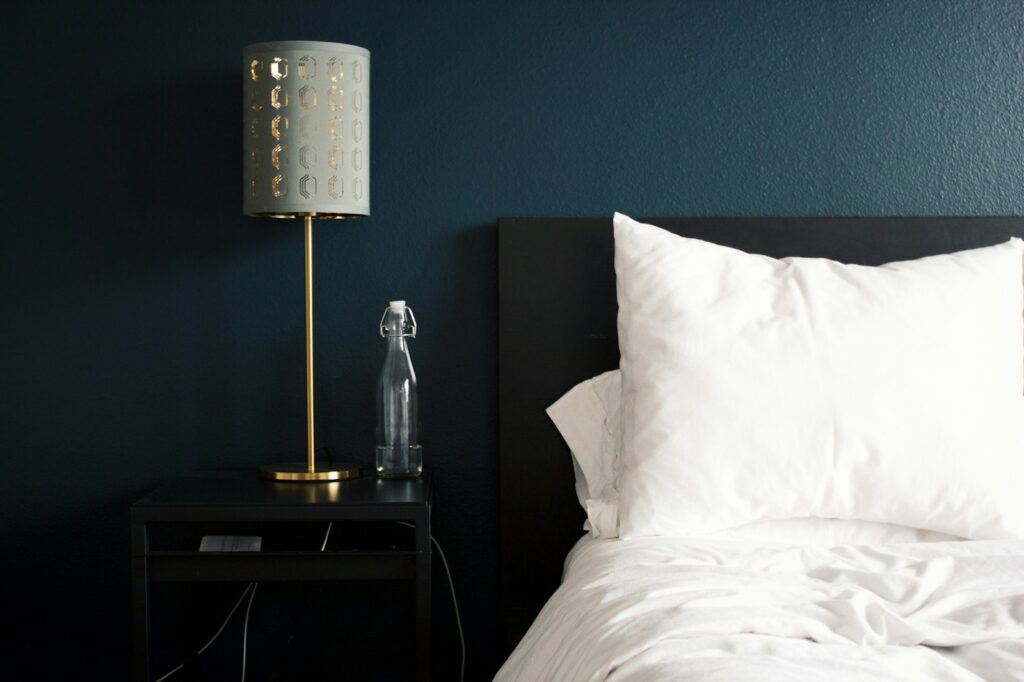 Bedside table and reading lamp in a guest room