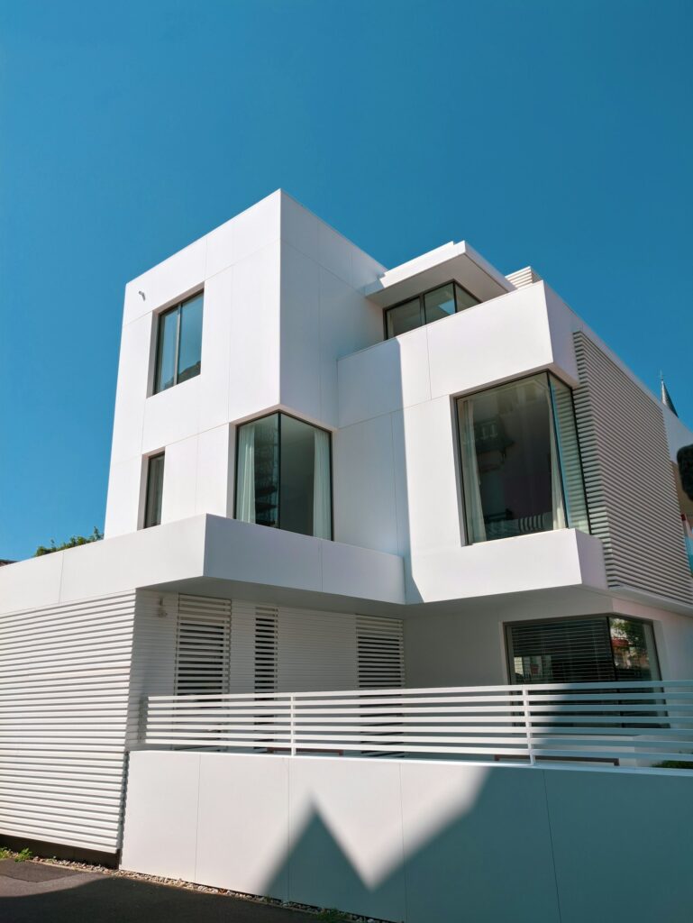White concrete house under a blue sky, house for sale Selangor Malaysia